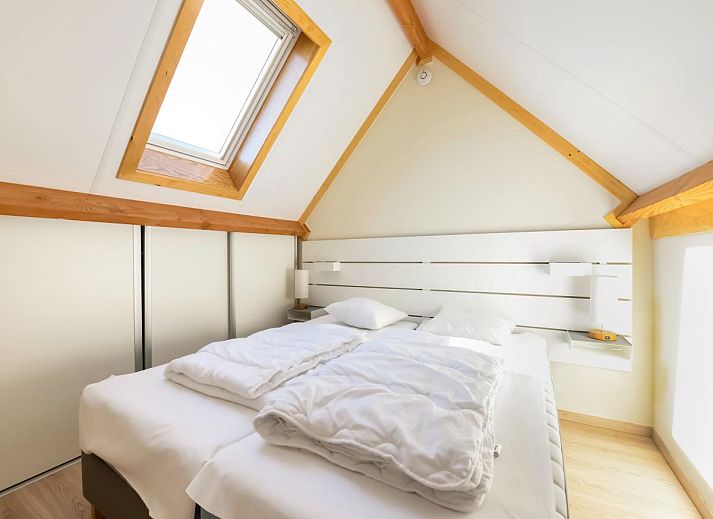 Gemuetliches Wohnzimmer des Ferienhauses Westhinder II H53 in Koksijde, Belgien, mit bequemer Sitzecke und moderner Einrichtung.