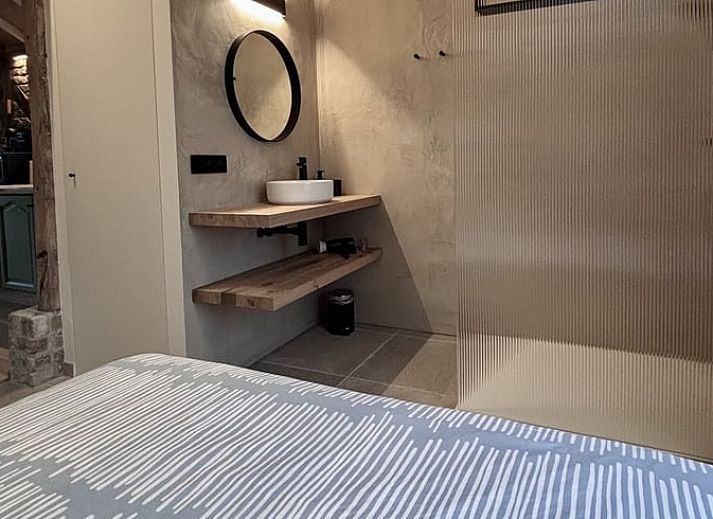 Cozy kitchen in Cottage in Alveringem, cottage in West Flanders, Belgium with rustic brick walls and modern amenities.