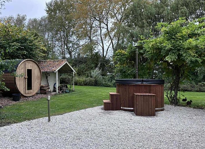Cozy kitchen in Cottage in Alveringem, cottage in West Flanders, Belgium with rustic brick walls and modern amenities.