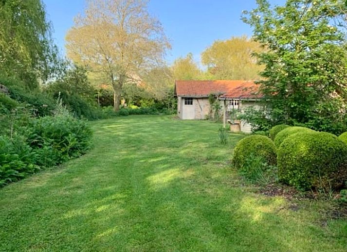 Cozy kitchen in Cottage in Alveringem, cottage in West Flanders, Belgium with rustic brick walls and modern amenities.