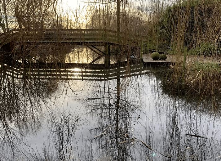 Attractive bedroom in Cottage in Alveringem, a vacation home in Alveringem, West Flanders, overlooking serene nature.