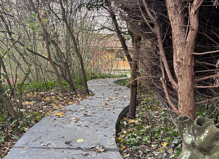 Cozy living room of Cottage in Alveringem, vacation home in West Flanders, with wood stove and television for ultimate relaxation.