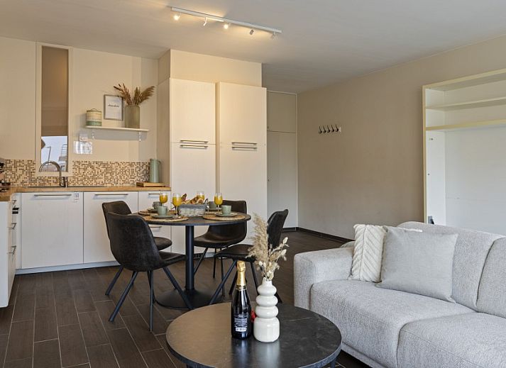 Bright living room and dining area in Flat Marthe, Sint-Idesbald, ideal apartment for a vacation on the Belgian coast.