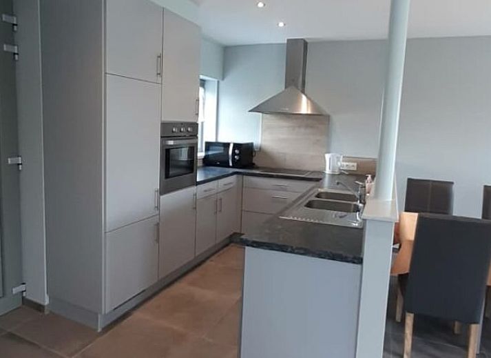 Groene tuin bij Vakantiehuis in Merkem, ideale vakantiewoning in West-Vlaanderen voor natuurliefhebbers.