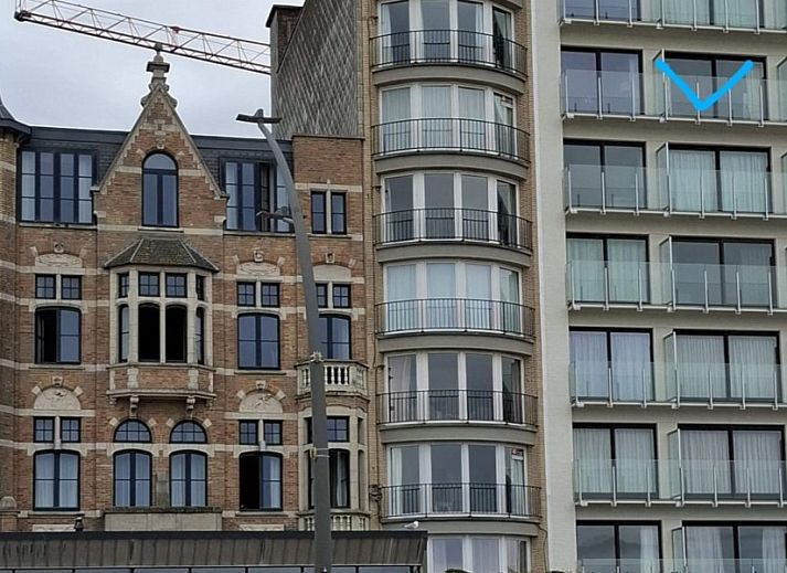 Ramses studio apartment in De Panne, Belgian coast, overlooking historic facades and modern architecture.