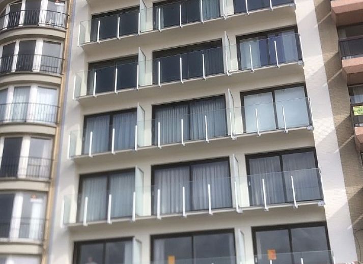 Ramses studio apartment in De Panne, Belgian coast, overlooking historic facades and modern architecture.