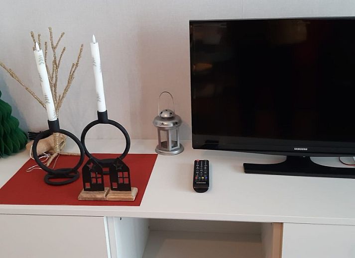 Exterior of Ramses studio apartment in De Panne, Belgian coast, next to a characteristic building.