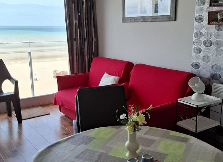 Exterior of Ramses studio apartment in De Panne, Belgian coast, next to a characteristic building.