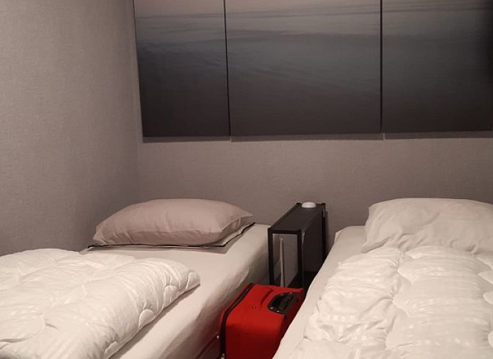 Exterior of Ramses studio apartment in De Panne, Belgian coast, next to a characteristic building.