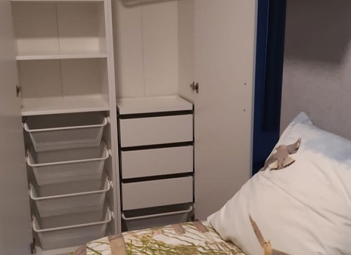 Front of Ramses studio apartment in De Panne, Belgian coast, with stores at foot.