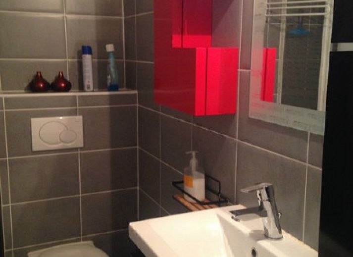 Front of Ramses studio apartment in De Panne, Belgian coast, with stores at foot.