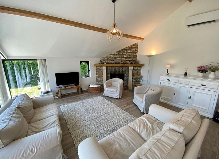 Petunias Deluxe-Ferienhaus in Sint-Idesbald, Westflandern, mit sonnigem Garten und traditioneller Architektur fuer einen entspannten Aufenthalt.