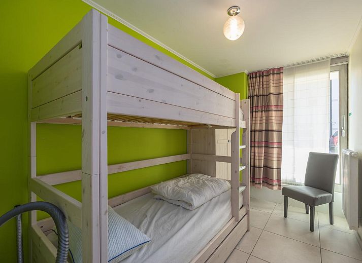 Gemuetliches Wohnzimmer im Ferienhaus Baros - 0001 in Middelkerke, Westflandern, mit moderner Kueche und gemuetlicher Sitzecke.
