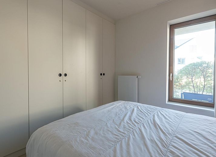 Genieten van het zwembad bij vakantiehuis West Bay in Westende, West-Vlaanderen, Belgie, met uitzicht op de natuur en ontspannende sfeer.