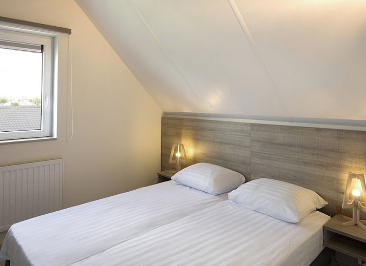 Stilvolles Wohnzimmer des Bungalows Comfort 4 in Bredene an der belgischen Kueste. Gemuetlicher Innenraum mit modernem Dekor und viel natuerlichem Licht.