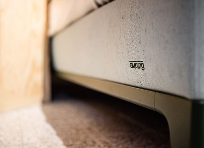 Modern bar in WOWie&Germain vacation home, Oostduinkerke, with stylish stools and playful decor.