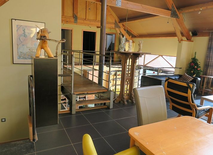 Dining room overlooking the garden in De Mutsaard, vacation home in the Flemish Ardennes, Belgium.