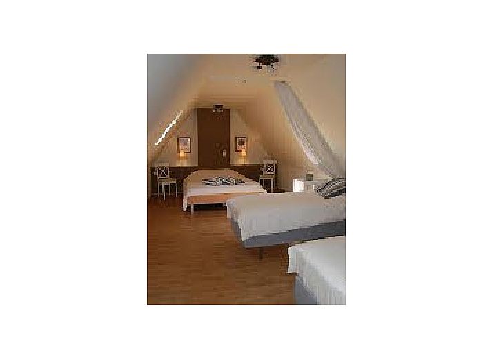 Gezellige woonkamer van Dijkhuisje De Maretak in Assenede, vakantiehuis met sfeervolle inrichting.