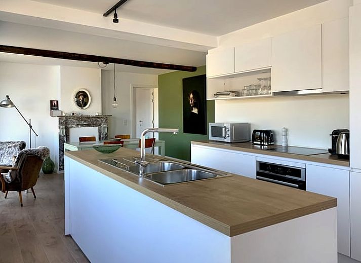 Bright interior of Cottage in Zulzeke, view of green nature in the Flemish Ardennes, East Flanders.
