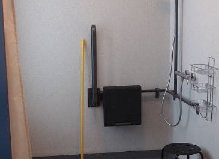 Stylish seating area inside DE KLEPPE vacation home in Brakel, ideal for relaxation and togetherness.