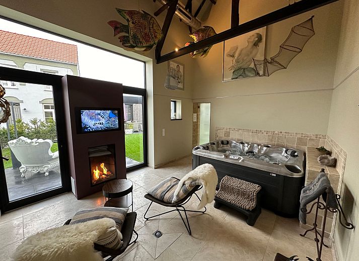 Relax in the luxurious wellness area of Holiday Home Einzigartiger Wellness-Bauernhof in Wichelen, East Flanders, with jacuzzi and fireplace.