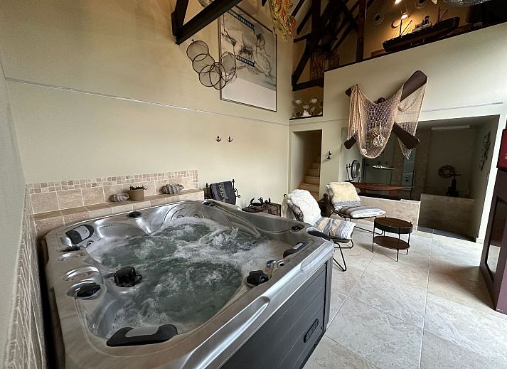 Relax in the luxurious wellness area of Holiday Home Einzigartiger Wellness-Bauernhof in Wichelen, East Flanders, with jacuzzi and fireplace.