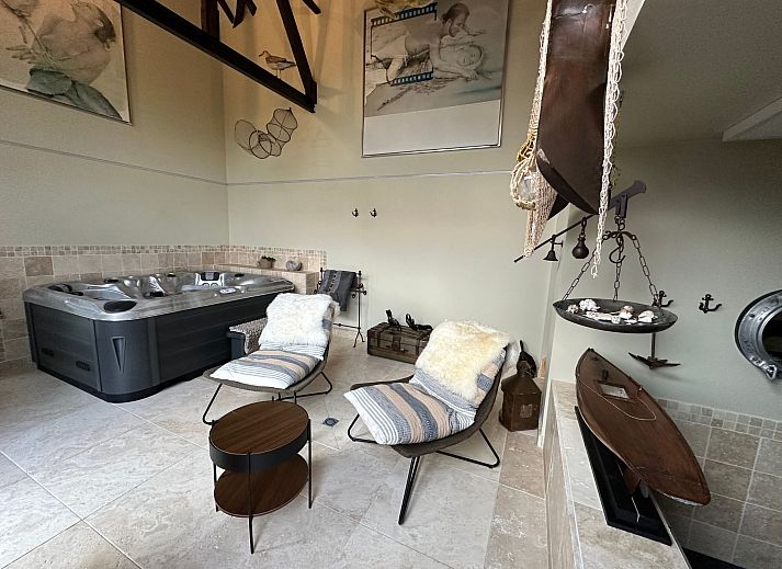 Relax in the luxurious wellness area of Holiday Home Einzigartiger Wellness-Bauernhof in Wichelen, East Flanders, with jacuzzi and fireplace.