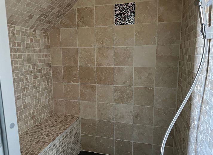 Relax in the luxurious wellness area of Holiday Home Einzigartiger Wellness-Bauernhof in Wichelen, East Flanders, with hot tub and rustic atmosphere.