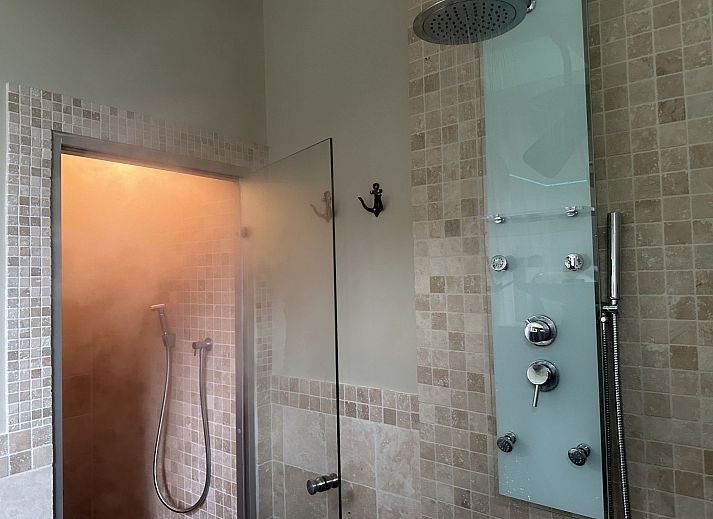 Relax in the luxurious wellness area of Holiday Home Einzigartiger Wellness-Bauernhof in Wichelen, East Flanders, with hot tub and rustic atmosphere.