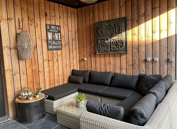 Relax in the luxurious wellness area of Holiday Home Einzigartiger Wellness-Bauernhof in Wichelen, East Flanders, with hot tub and rustic atmosphere.