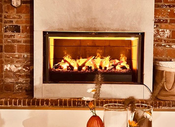 Vakantiehuisje in Landskouter-Oosterzele met charmante gevel en groene tuin in Oost-Vlaanderen, Belgie.