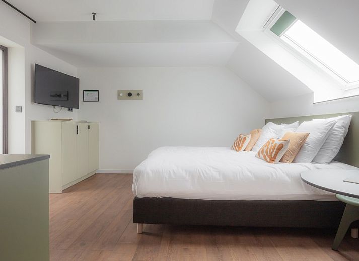 Gemuetliches Wohnzimmer im Ferienhaus Gare 55 in Ertvelde, Ostflandern, mit viel Tageslicht.