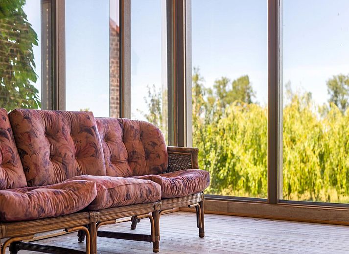 Veranda of Quanto A vacation home in Geetbets, Flemish Brabant overlooking green nature.