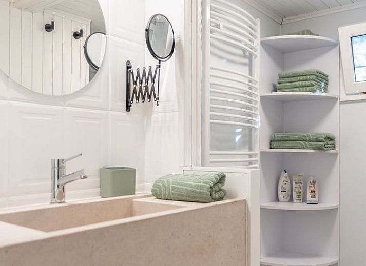 Attractive bedroom in Cottage in Merksplas, vacation home in Antwerp, with comfortable bed and rustic details.