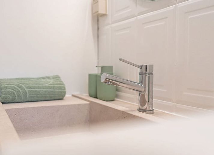 Attractive bedroom in Cottage in Merksplas, vacation home in Antwerp, with comfortable bed and rustic details.