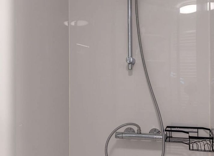 Attractive bedroom in Cottage in Merksplas, vacation home in Antwerp, with comfortable bed and rustic details.