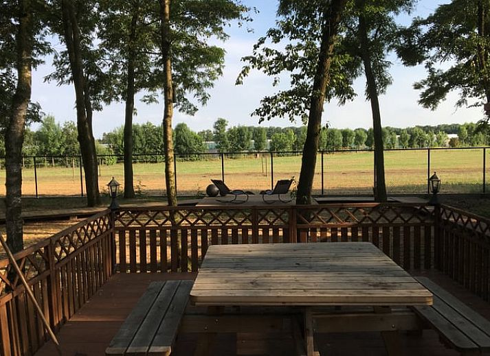 Cottage in Merksplas, cottage in Antwerp with campfire spot and rainbow in green surroundings.