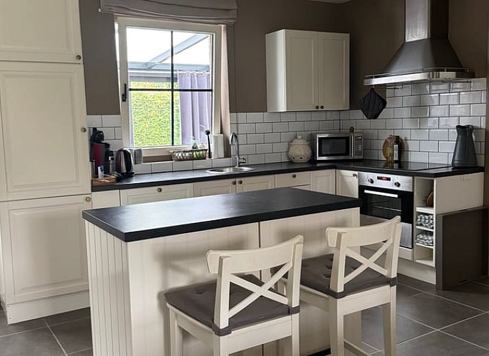 Vacation home in Merksplas, Antwerp, offers a cozy outdoor area with terrace surrounded by green nature for a relaxing stay.