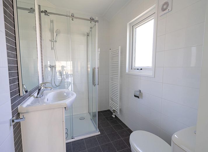 Cozy living room of vacation home Velthorst in Mol, Antwerp, Belgium, with modern decor and lots of natural light.
