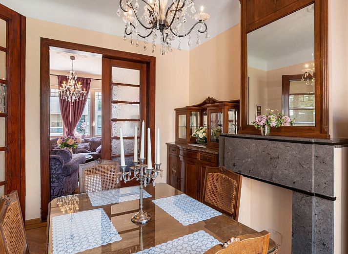 Cozy living room of Holiday Home Jasmine in Mol, Antwerp, with lots of light and access to the terrace for a relaxing stay.