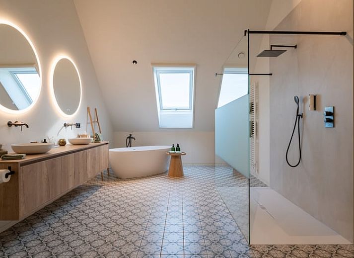 Atmospherically lit exterior of Holiday Home in Kasterlee, Antwerp, Belgium, surrounded by green nature at dusk.