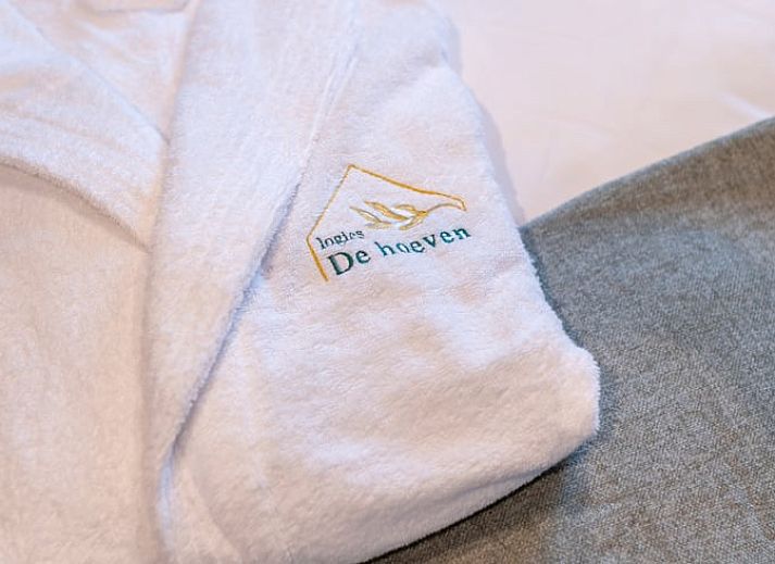 Cozy illuminated terrace at Holiday Home in Kasterlee, Antwerp, Belgium, surrounded by peaceful nature and beautiful evening scenery.