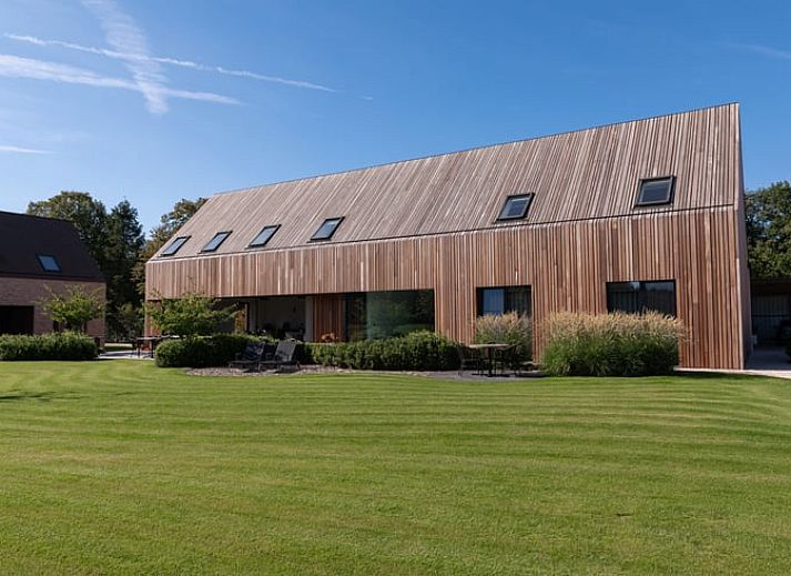 Enjoy the serene garden and expansive views at Holiday Home in Kasterlee, located in green Antwerp, Belgium.