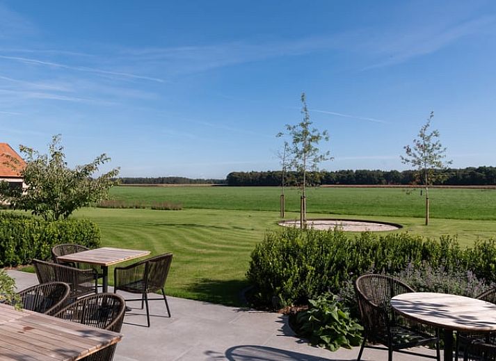 Enjoy the serene garden and expansive views at Holiday Home in Kasterlee, located in green Antwerp, Belgium.