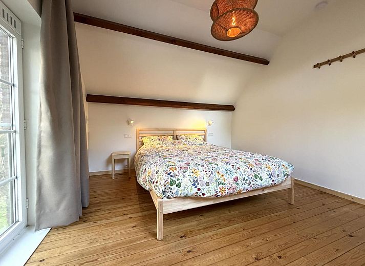 Stylish living room of Lierelodge vacation home in Oud-Turnhout, Antwerp, overlooking the terrace and surrounding nature.