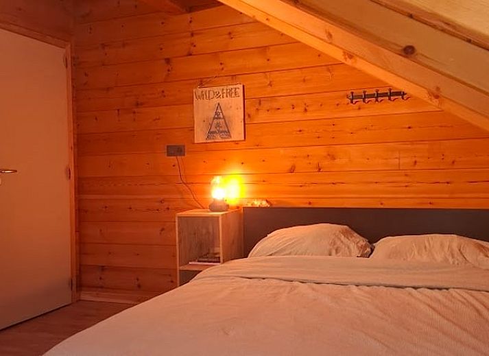 Essecke mit Blick auf den Garten im Ferienhaus in Wuustwezel, ideal fuer einen Familienurlaub in Antwerpen, Belgien.