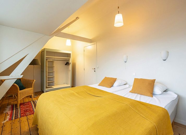 De Morgenstond vakantiehuis in Baarle-Hertog, Antwerpen, biedt een charmante buitenkant met groene omgeving en zonnige hemel.