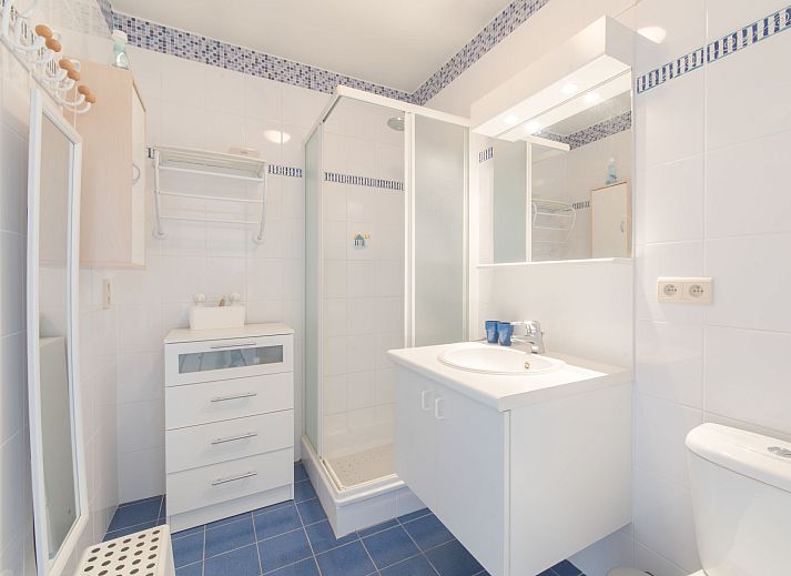 Cozy indoor area of Apartment Bowie with shared pool in De Haan, Antwerp, Belgium, with dining area and balcony views.