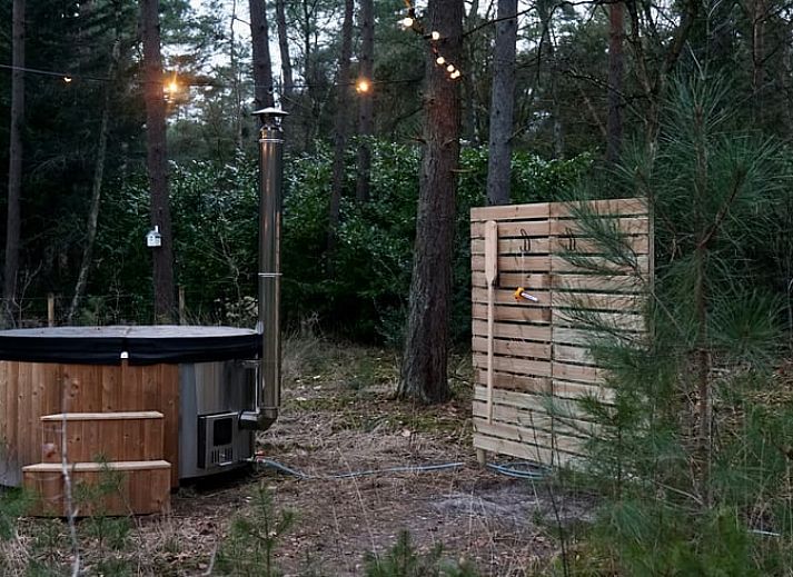 Moderne buitenruimte met zitgedeelte bij Vakantiehuisje in Wechelderzande, Antwerpen, Belgie. Ideaal voor ontspanning.