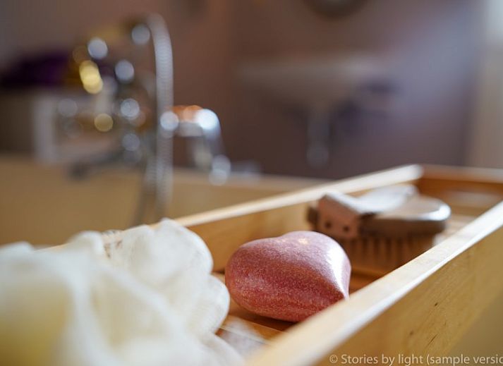 Charming vacation home Tivoli in Dilsen-Stokkem, Limburg, Belgium, surrounded by green nature and rustic architecture.